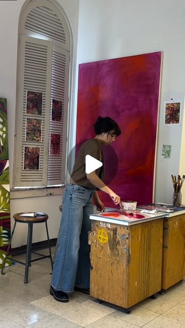 Mia working at her painting table