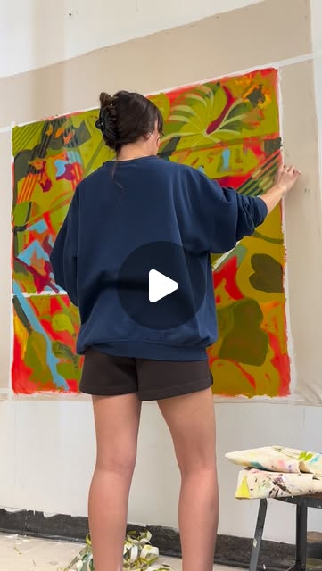 Mia painting in the studio