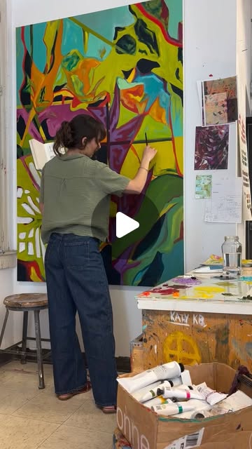 Mia painting in her studio